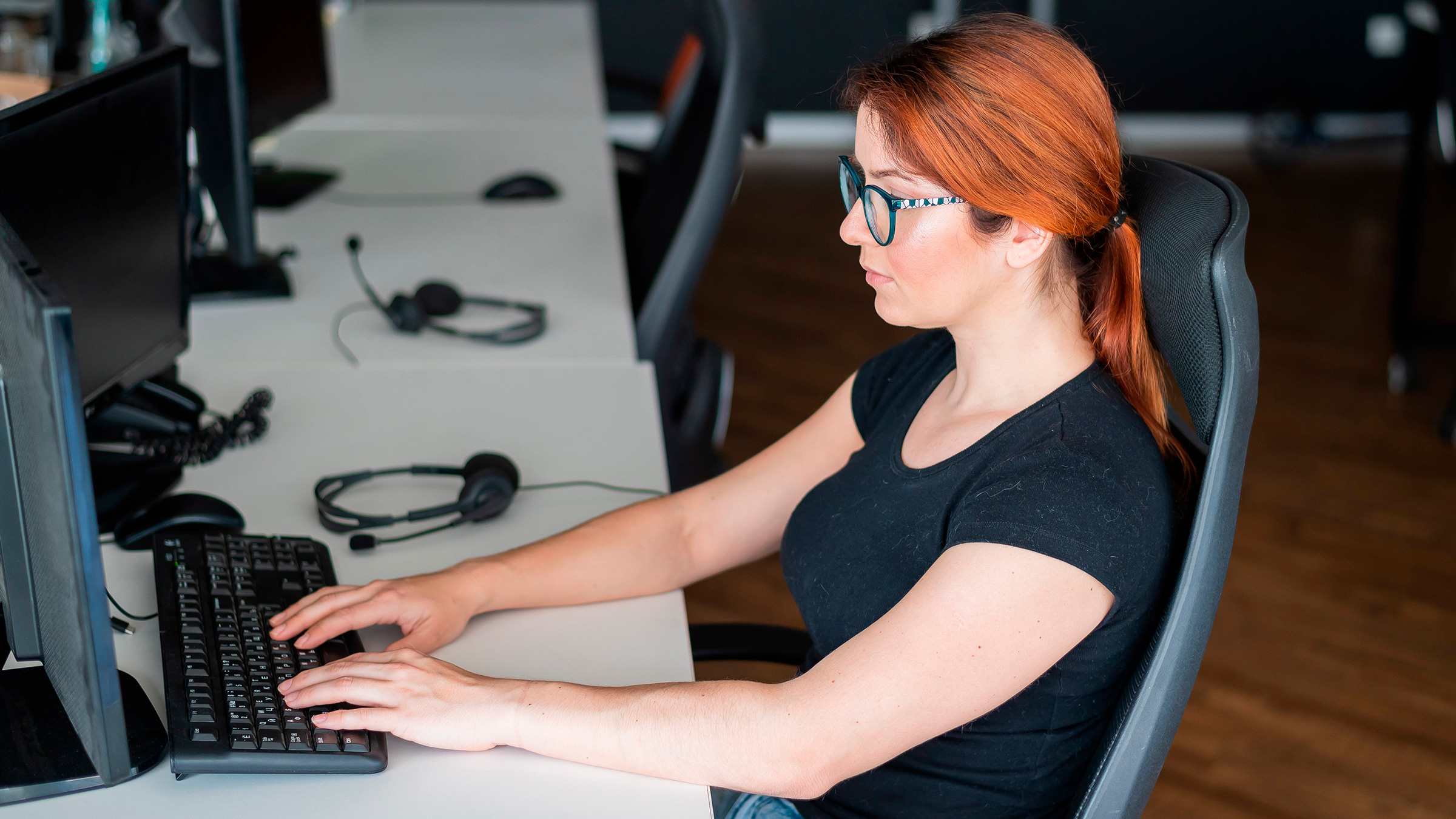 female programmer at keyboard